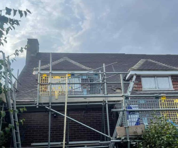 This is a photo of a roof with two dormers that is having some damaged tiles replaced. Works carried out by WBN Roofing Rossington