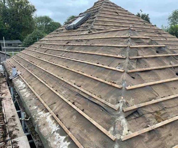 This is a photo of a hip roof that has been stripped back to the battens, and is awaiting a new roof covering to be installed. Works carried out by WBN Roofing Rossington